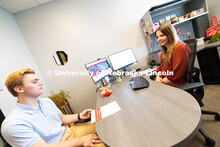 Meredith Cain, Academic Navigator for the College of Arts and Sciences, listens to Jack Hibbs, a sen