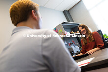 Meredith Cain, Academic Navigator for the College of Arts and Sciences, listens to Jack Hibbs, a sen