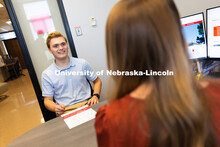 Meredith Cain, Academic Navigator for the College of Arts and Sciences, listens to Jack Hibbs, a sen