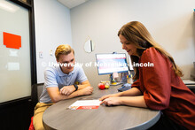 Meredith Cain, Academic Navigator for the College of Arts and Sciences, speaks with Jack Hibbs, a se