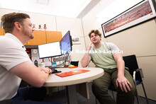 Adam Christiansen, Academic Navigator in the Explore Center, speaks with Jacob Behnk, a senior study
