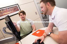 Adam Christiansen, Academic Navigator in the Explore Center, speaks with Jacob Behnk, a senior study