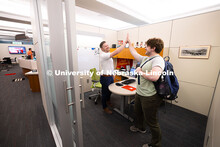 Adam Christiansen, Academic Navigator in the Explore Center, gives a high five to Jacob Behnk, a sen