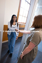 Laura Britten, Academic Navigator in the Explore Center, shakes hands with Swati Yadav, a sophomore 