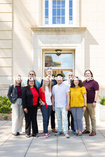 The Center for Academic Success and Transition team pose for a group photo outside of Love Library S