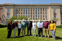 The Center for Academic Success and Transition team pose for a group photo outside of Love Library S