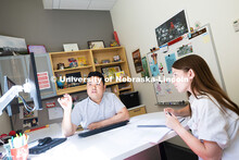 Donny Bui, an academic success coach in the Center for Academic Success and Transition, meets with K