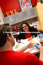 Mari Beck talks with Jacob Behnk, a senior studying Spanish and global studies, in her office in the