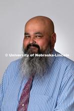 Studio portrait of Joel Cardenas, Academic Success Coach for the Center for Academic Success and Tra