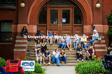 A group of spectators sit on the stairs of Architecture Hall for the final session of Jazz in June. 