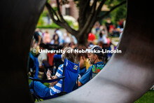 A couple sits in front of the Fragment XO sculpture while enjoying the final session of Jazz in June