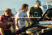 Members of the UNL Figure 8 Racing Team troubleshoot in the parking lot south of the Polk County Fai