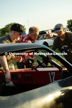 Members of the UNL Figure 8 Racing Team troubleshoot in the parking lot south of the Polk County Fai