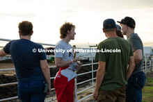 Ian Gouldie, a robotics engineering major and driver for the UNL Figure 8 Racing Team, stands with h