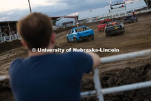 Grant Gouldie, a junior studying electrical engineering, watches cars zip around the Polk County Fai