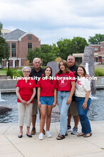 Sisters Madison and Lauren Haring pose with their family in front of Broyhill Fountain. The Haring f