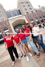 Sisters Madison and Lauren Haring pose with their family, plus Kevin Coleman, outside of Memorial St