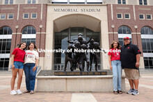 Sisters Madison and Lauren Haring pose with their family outside of Memorial Stadium. The Haring fam