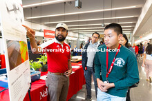 Aldi Airori, research technologist in the department of agronomy and horticulture, speaks with Natha
