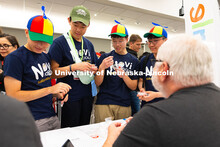 Novi High School students Sam Yako, Wenhan Xu and Ian Jeong (l-r, wearing propeller hats), and Peter