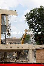 A concrete pulverizer attachment is used on an excavator to break apart the former Westbrook Music B