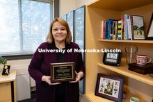 Portrait of Barbara Woodhead, Director of Services for Students with Disabilities in her office in P