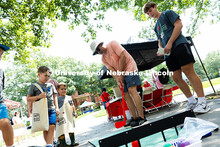 Jim Kolbo uses a plastic putter to aim for the target in a probability game at the 4-H booth during 