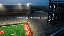 Aerial view of Memorial Stadium lights flooding the Tom Osborne Field at sunrise. August 12, 2025. 