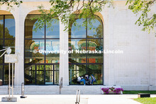 Sydney DeRoin, Chloe Burgett and Jordan Nova, all employees of the Sheldon Museum of Art, enjoy work