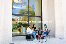 Sydney DeRoin, Chloe Burgett and Jordan Nova, all employees of the Sheldon Museum of Art, enjoy work