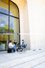 Sydney DeRoin, Chloe Burgett and Jordan Nova, all employees of the Sheldon Museum of Art, enjoy work