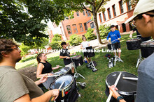 The Cornhusker Marching Band percussionists practice in the shade during Marching Band camp. August 