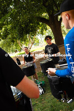 The Cornhusker Marching Band percussionists practice in the shade during Marching Band camp. August 
