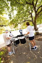 The Cornhusker Marching Band percussionists practice in the shade during Marching Band camp. August 