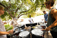 The Cornhusker Marching Band percussionists practice in the shade during Marching Band camp. August 