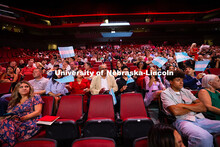 Family members wave Honduran flags to the beat of "There is No Place Like Nebraska" as the recession