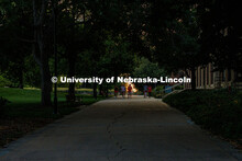 Students crossing campus as the sun sets on City Campus in the summer. August 21, 2025. 