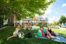 Students lounge on the lawn outside of Kappa Alpha Theta in between sorority recruitment events. Aug