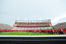Freshman students form an N on the Memorial Stadium field for the class of 2029 photo during the 202
