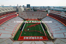 Freshman students form an N on the Memorial Stadium field for the class of 2029 photo during the 202