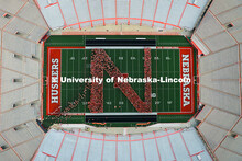 Freshman students form an N on the Memorial Stadium field for the class of 2029 photo during the 202