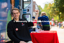 Maddock Oberzan, a junior studying finances and economics, holds up a fist after donating blood duri