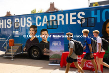 Students walk by a Nebraska Community Blood Bank bus during the first campus blood drive of the year