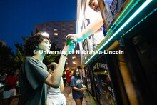 Carter Younger, a first-year student studying architecture, receives a snow cone from the Kona Ice t
