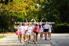 Sorority recruits walk across campus near the Nebraska Union. Sorority Rush Week. August 18, 2025. 