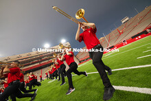A smattering of raindrops fall on members of the trombone line as they pose during one of several sp