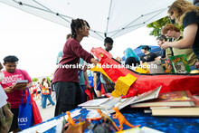 Tayven Washington, a first-year student studying software engineering, sticks his hand into the mout