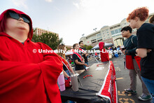 First-year students Kai White (right) and Eddy Alcaid (second to right) chat with members of the Inn
