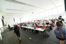 Students trickle into Qing Hui's Elements of Electrical Engineering course in Kiewit Hall on the fir