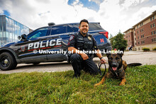 Anderson Delgado, a Police Sergeant and Explosive Detective Canine Handler for UNLPD, poses in front